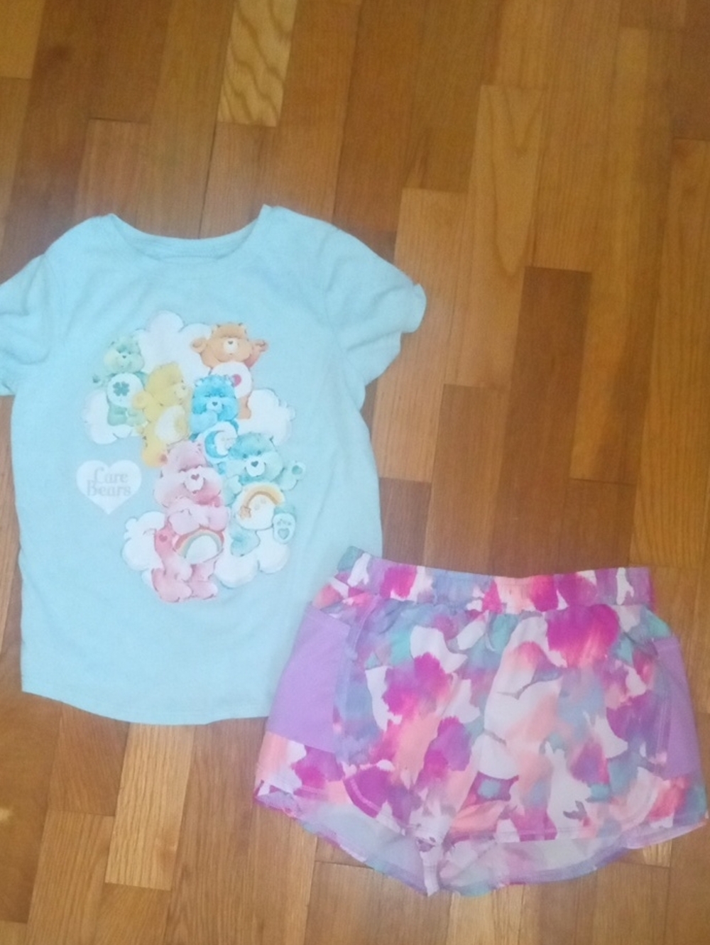 girl 6 multi color drifit shorts and Care Bears tee
